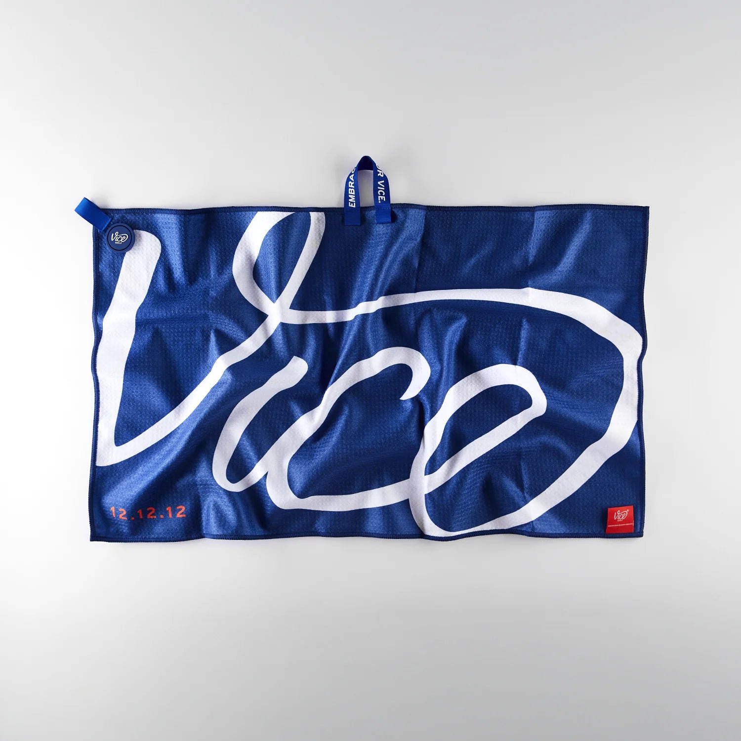 Blue towel with 'Vice' branding on a white background