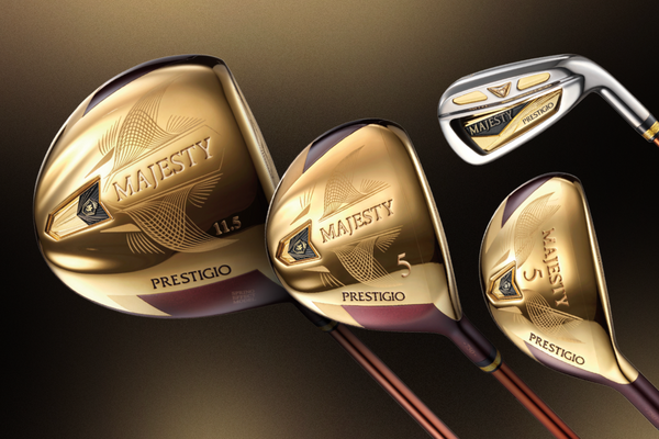Three golf clubs with 'Majesty' branding on a dark background